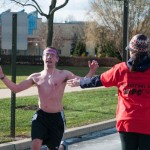Shirtless despite the cold, physical fitness specialist major Eric S. Ross, of Orwigsburg, finishes the race.