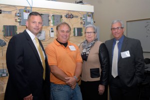 Honeywell representatives Gary Drew (left) and David Teston (right) join Todd S. Woodling, assistant professor of building automation technologies/HVAC electrical, and Penn College President Davie Jane Gilmour for dedication of a new building automation lab.