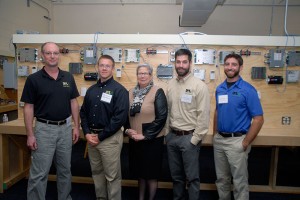 Penn College President Davie Jane Gilmour welcomes four Ecosave employees, all of them alumni, back to campus. From left are William J. Stachnik (2008), John A. Crane (2011), Andrew D. Warwick (2011) and Beau C. Woodrick (2011).