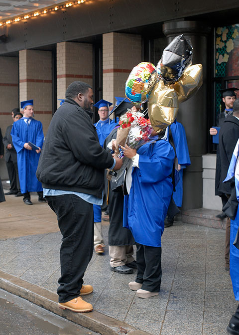 A new graduate is inundated with balloons, flowers and a whole lot of love.