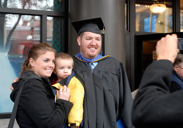 Paul A. McGinn, a business administration: marketing concentration graduate from South Williamsport, celebrates with his family.
