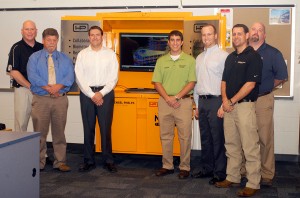 Accompanying the donation of a wireless kiosk for Penn College's construction management major are, from left, David W. Milford, regional manager for Hensel Phelps; Marc E. Bridgens, dean of the college's School of Construction & Design Technologies; John A. Cowan, operations manager for the company; students Nicholas S. Tomaine and Lane M. Ackerman; Brian J. Fish, project superintendent and a 2002 alumnus; and Wayne R. Sheppard, assistant professor of construction management.
