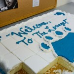 Wildcat pawprints lead attendees to cake and other refreshments.