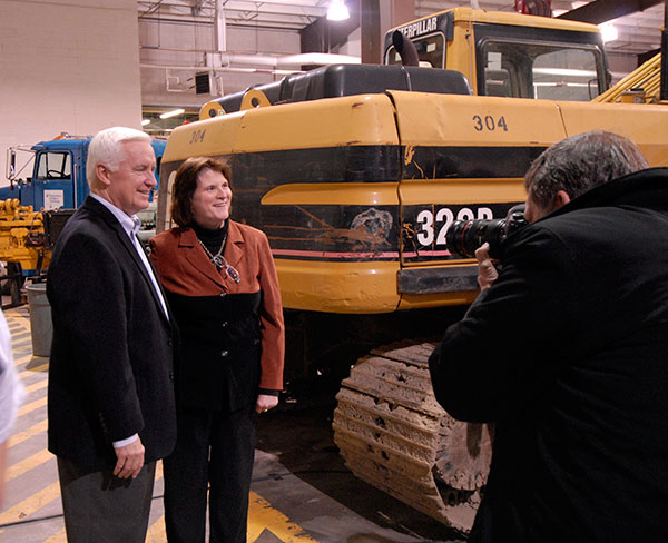 The governor poses for a photo with Mary A. Sullivan, executive director of the Earth Science Center and assistant dean of transportation and natural resources technologies.