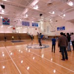 Fans line up for halftime fun, paying $1 each for the chance to sink a midcourt shot and quintuple their money.