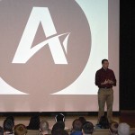 Alongside his nonprofit's logo, Hudson Taylor spreads his message of allyship.