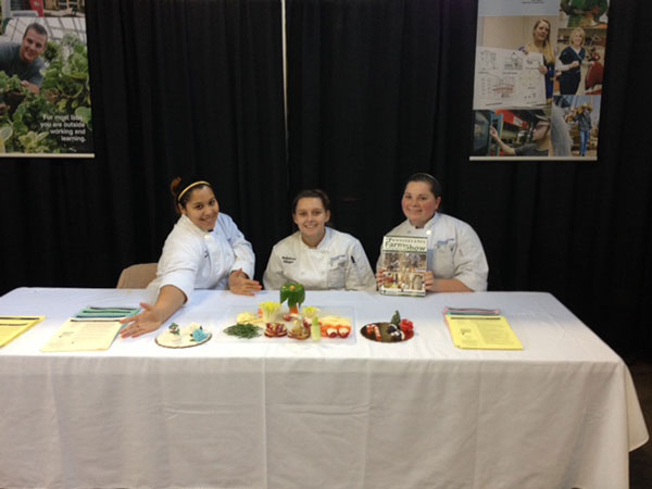 Showing off attractive and creative garnishes are (from left) culinary arts and systems students Alyssa J. Morales, of Reading, and Rebecca L. Klinger, of Cogan Station; and culinary arts technology major Maria K. Maneval, of Richfield.