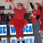 Commuter Assistant Lauren J. Crouse gauges audience applause for a contestant.