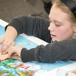 A blend of concentration and coordination maneuvers a building block into place.