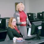 Kim E. Shipman (standing) lends a helping hand to Karen L. Plankenhorn, clinical supervisor, radiography.