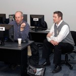 Clark D. Sarge, a member of the physics faculty (left), is joined by Joshua D. Young, learning systems administrator, in a Madigan Library computer classroom.