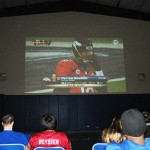 Forgiving fans endure a lopsided Super Bowl, projected (thanks to ITS) on a Field House wall.