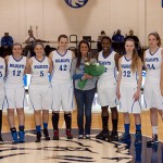 ... and by her Lady Wildcats teammates.