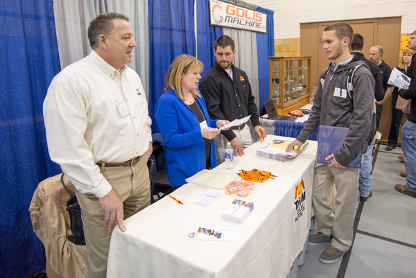 Robert Dobosh, Cheryl Danilowicz and alumnus (and current student) Scott D. Hubler of Tri-M Group talk with electrical occupations student Jared M. Blair.