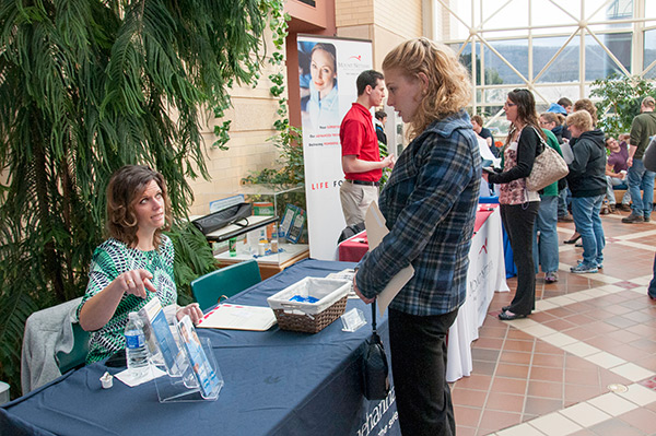 Shannon L. Abercrombie, a student in applied health studies: occupational therapy assistant concentration, talks with Mary Burns, director of nurse recruitment for Susquehanna Health.