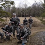 Cadet Jon Mane, from Bucknell, teaches his squad how to properly place a claymore mine.