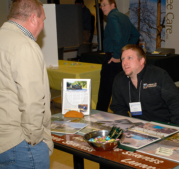 Jared W. Adams (seated), a 1997 alumnus of the former landscape/nursery technology major, reunites with horticulture instructor Carl J. Bower Jr.