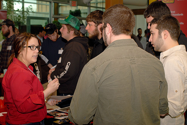 Halliburton's Kristy Celitti talks with students at the company's popular ESC booth.