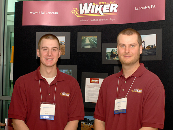 Daniel J. Hickel (left) and Benjamin M. Webber, both of whom graduated last year with multiple degrees in heavy construction equipment technology emphases, are among the Penn College alumni employed by H.L. Wiker Inc.