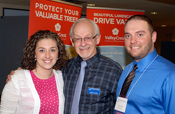 Master Teacher Dennis F. Ringling, soon to retire after more than four decades of teaching forestry, catches up with King's Sawmill Inc. representatives Jeffrey S. Liedtka ('07, forest technology) and wife Lindsay.