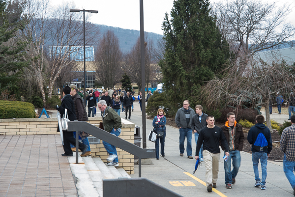 Pedestrian traffic flows along the campus mall, just outside the Keystone Dining Room.