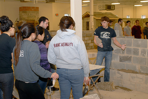 Demonstrating work with natural stone harvested from Bald Eagle Mountain is Wade A. Jacobson, of Alexandria, Va., enrolled in residential construction technology and management: building construction technology-masonry concentration.