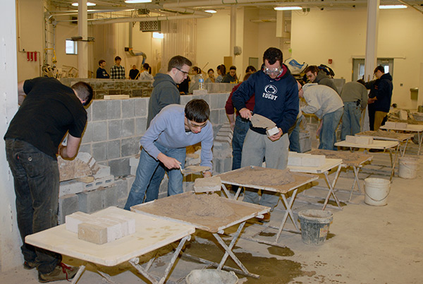 One of the more popular stations challenges students to construct a brick archway ...