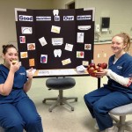 Dental hygiene students Brittany R. Hartzler, of Dover (left), and Natalina R. D'Urso, of Greenville, promote healthy snacks at their oral-health education station.