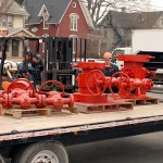 Facilities supervisor Barry L. Loner Jr. begins offloading the heavy cargo via lift truck.