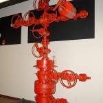 The assembled wellhead rises about 12 feet from the laboratory floor.