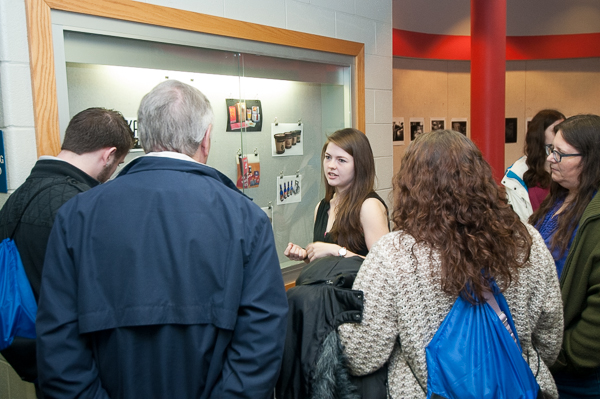 Erin M. Schlesinger, of Lock Haven, an award-winning graphic design student, engages families on the second floor of the Campus Center.