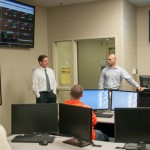 Shawn A. Wilson (left) and Seth A. Martin offer practical career insights to students in the technology-filled Financial Markets Investments Lab. Wilson said the technology at Penn College helped to attract him as a prospective student.