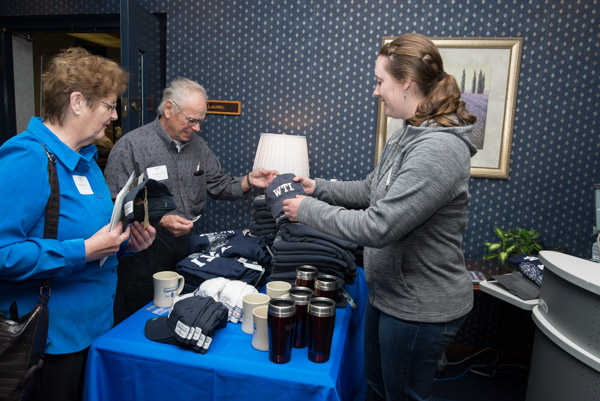 It was brisk business for The College Store's traveling WTI memorabilia table, with V. Wallace Centi ('60, carpentry and machinist), and wife, Priscilla, purchasing items from student Kendel F. Baier, part-time stock clerk/cashier.