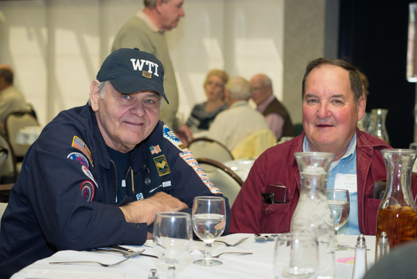 William Frick ('55, auto mechanics) sports a Williamsport Technical Institute baseball hat and chats with Jon Engel ('60, electrical).