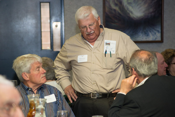 Talking shop, from left, are, John Dolan ('63, draftsman mechanical), Robert Schloder ('67 electrical technology), and business management alumnus Ronald Andrews.