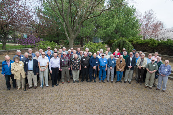 A special photo in this Centennial year: the institution's earliest graduates, assembled outside the PDC.