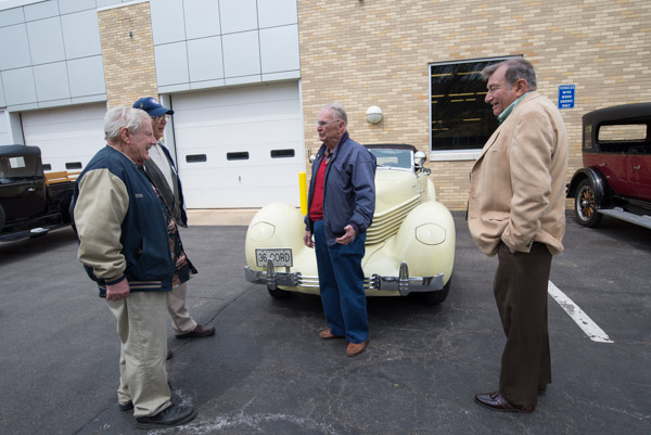 Al Light (center), of Williamsport, owner of the 1936 Cord 801 Phaeton, talks with the alums ...