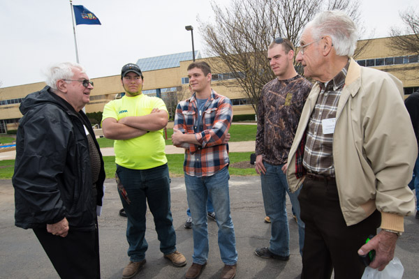 At left, WTI graduate Dyson Crownover ('60 electronics technology) and Vernon Winebark, right ('62, heavy construction equipment) talk with current students: from left, Austin J. Mills, diesel technology; Luke L. Snyder, building science and sustainable design: architectural technology concentration; and Cory M. Callihan, building automation technology: heating, ventilation and air conditioning technology concentration. Crownover told the students he paid $55 in cash for tuition every month, stayed at the YMCA for $6 a week (free on Sundays) and lived on lebanon bologna and peanut butter for the two years of his schooling. He also drove a 1950 Dodge to his classes in the 