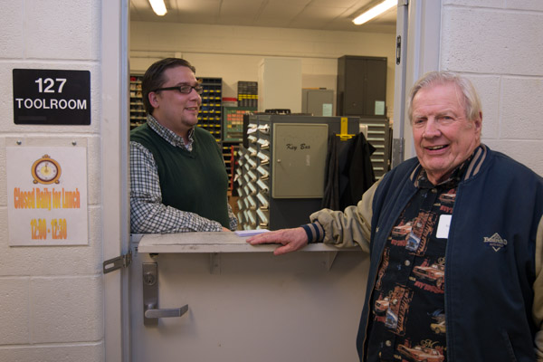 Richard Miller ('51, automotive) talks with automotive toolroom attendant James W. Daniels about procedures and the tools signed out by students. Daniels is a 2011 forest technology graduate and a senior in technology management.
