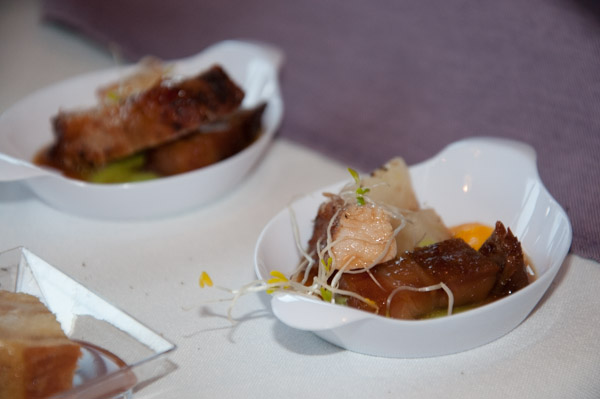 Benjamin A. King, of Elizabethtown, presents an entrée sample of maple bourbon-brined pork loin, braised pork belly, pea puree and fondant new potato with mustard-scented pork glace and carrot oil.