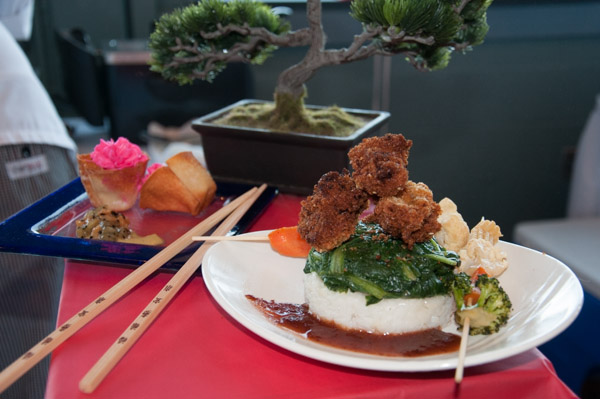 TeAnna M. Dorey, of Port Matilda, presents “Asian Flair” with her entrée, kaki-fried oysters on herbed Jasmine rice “cake” and a bed of sautéed spinach, and dessert, crispy baked wonton cups filled with creamy and fluffy guava mousse or chocolate.