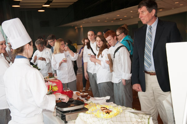 Culinary arts students present their samples to an appreciative crowd, including fellow students and alumnus Tom Baloga, ’74, who was on campus for the Automotive Centennial Celebration.