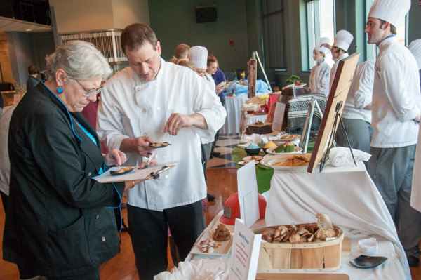 Judges Kim Morrison, of Cakes for Occasions in State College, and Chef Frank Priore, executive chef of the Westmoreland Club in Wilkes-Barre, sample a dish for scoring.