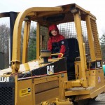 An ESC visitor finds shelter from the storm on a piece of Caterpillar machinery.