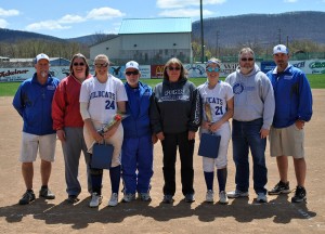 Coaches and families of Rachael Shaeffer (24) and Kimberly Walter (21) pause for a Senior Day salute at Elm Park. (Photo by Jami L. Hughes, coordinator of intercollegiate athletics and sports information)
