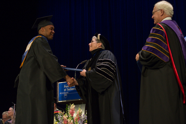 Assisting the president in presenting the diplomas was Sen. Gene Yaw, chairman of the college's Board of Directors.