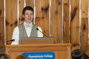Hughesville High School student Benjamin C. Nesselrodt, selected by fellow participants to speak at the program’s “graduation,” addresses participants and their families.