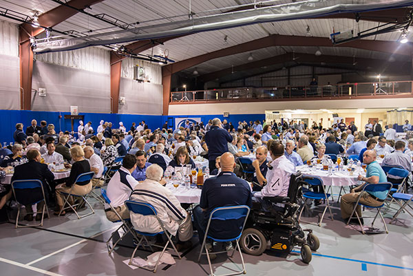 A sold-out crowd enjoys lunch with Penn State coaches.
