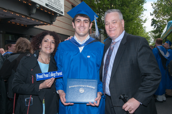 Connor T. Fitzsimmons, an automotive technology: Honda PACT graduate from Lansdale, poses with his proud parents. 