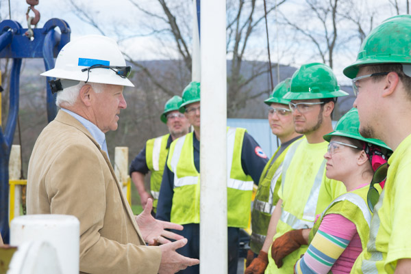 State Sen. Gene Yaw, chairman of the college board of directors, talks with students near the end of their two-day training on the rig.